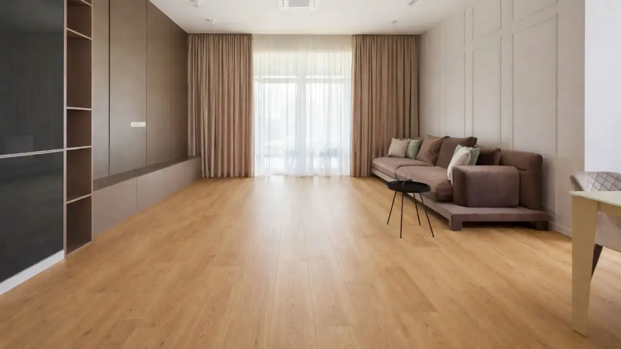 Modern living room with light oak hybrid flooring in Adelaide, featuring warm wood tones and seamless plank finish.