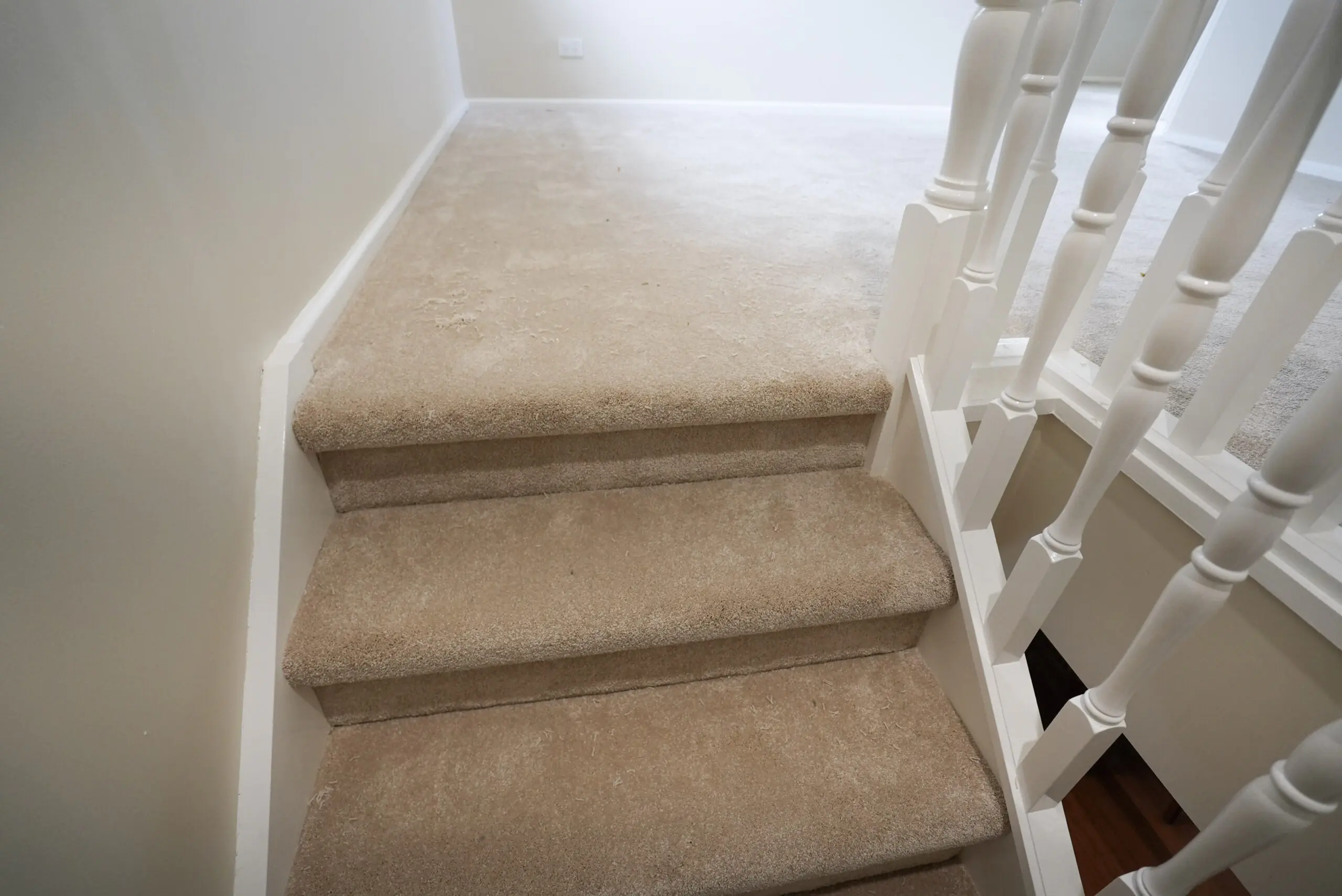 A staircase in Australian Home after the carpet flooring installed by Jim's Flooring.